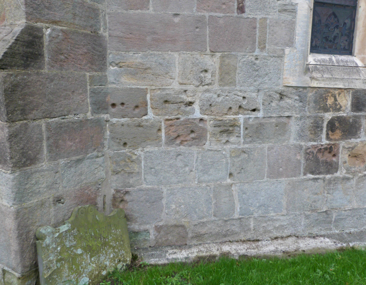 Musket ball holes in the east wall, Ripley church