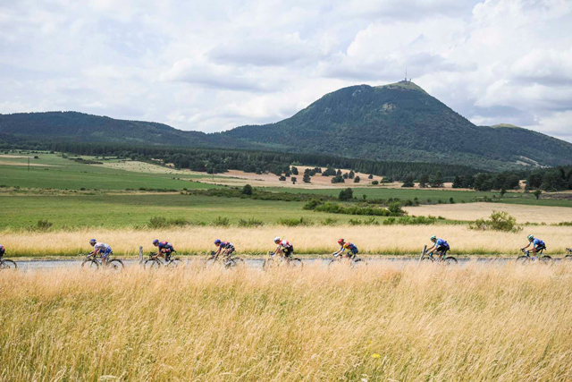 Riders pass the Puy de Dome on Stage 10 TDF 2025